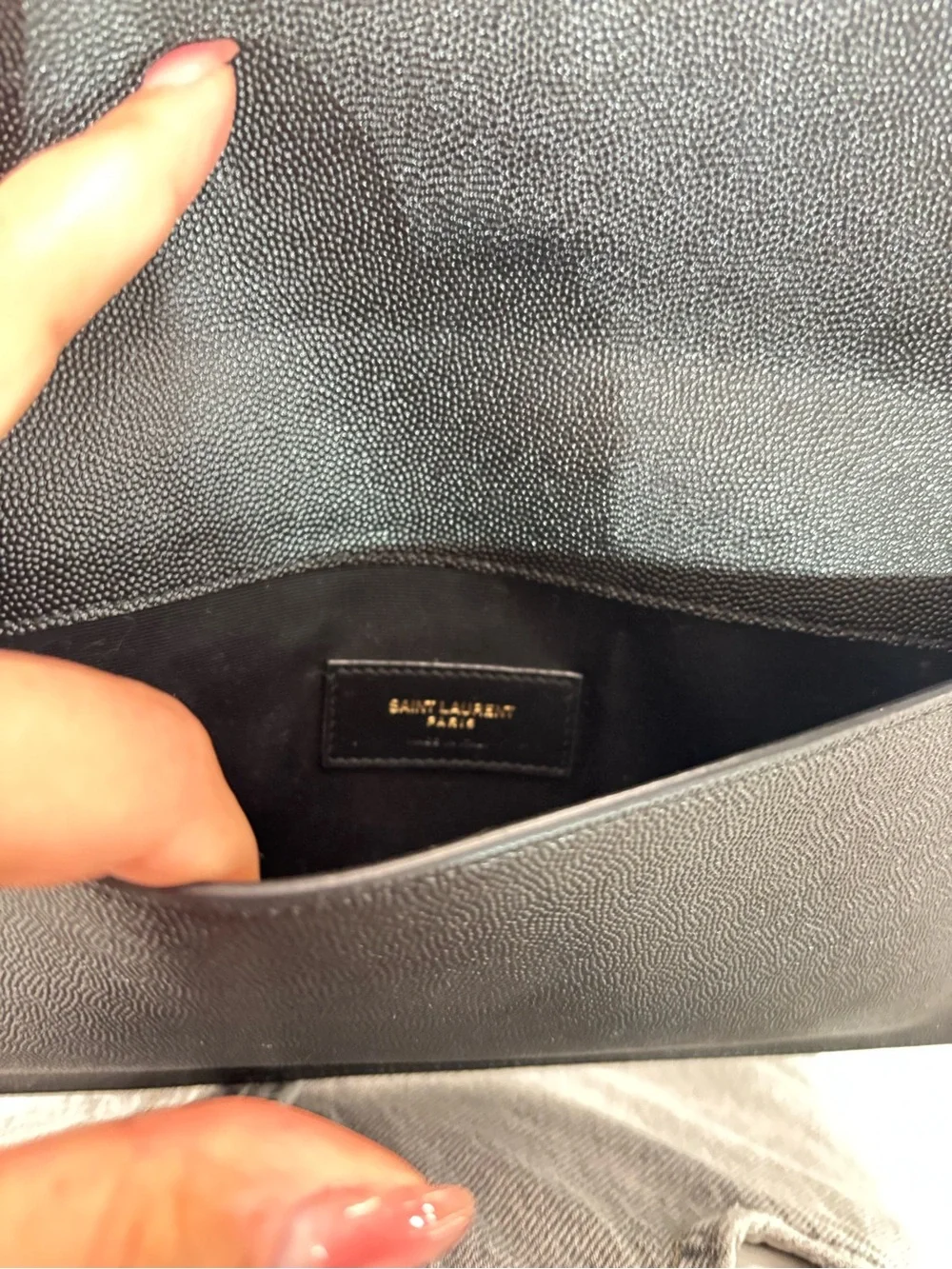 Saint Laurent Black Envelope Clutch retails now for 800$